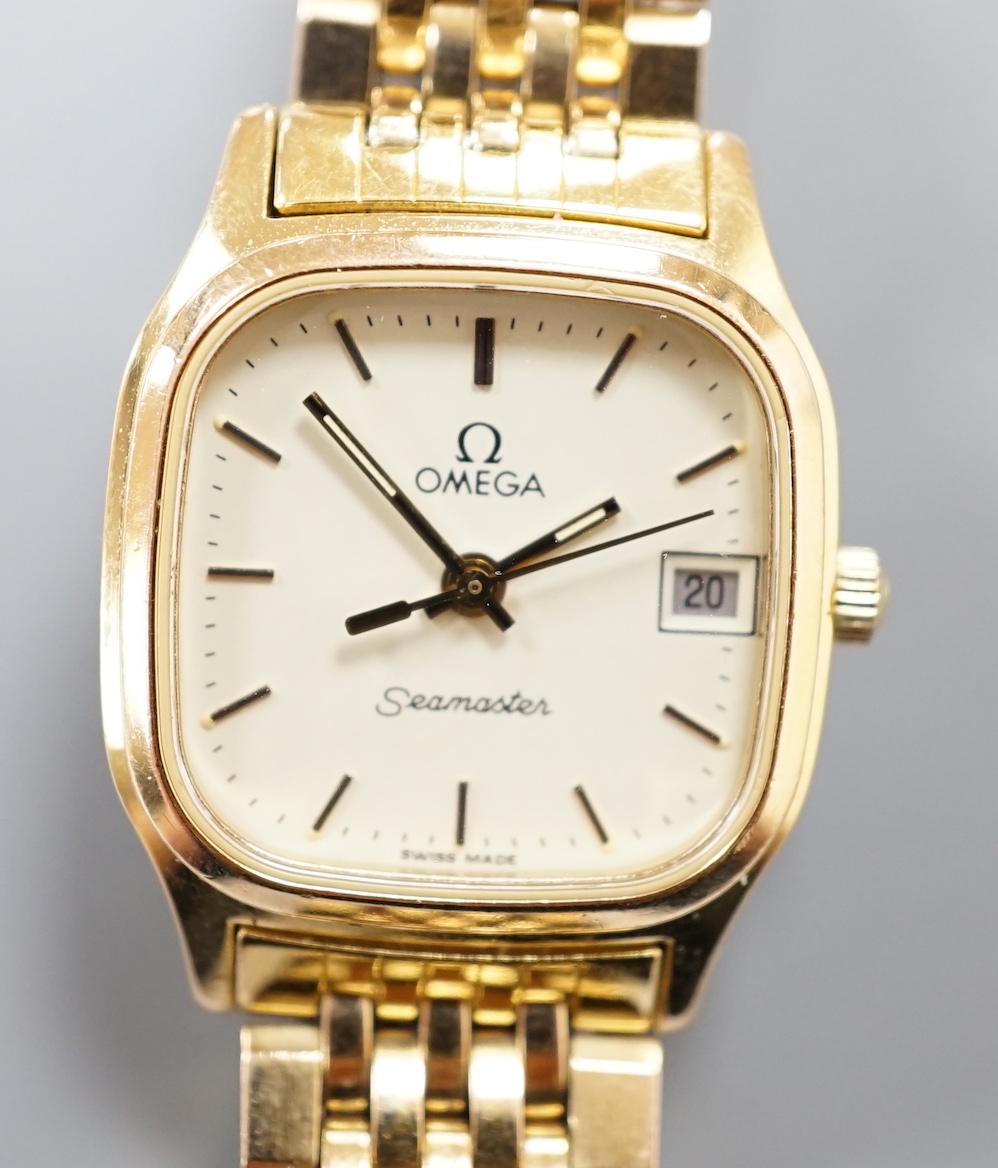 A lady's steel and gold plated Omega Seamaster quartz wrist watch, on an Omega gold plated bracelet (with spare links).